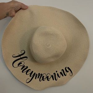 Honeymoon beach hat. One size. Never worn. Head strap if needed. Like cream.